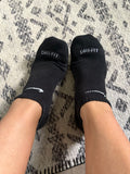Well worn/used black Nike women’s ankle socks